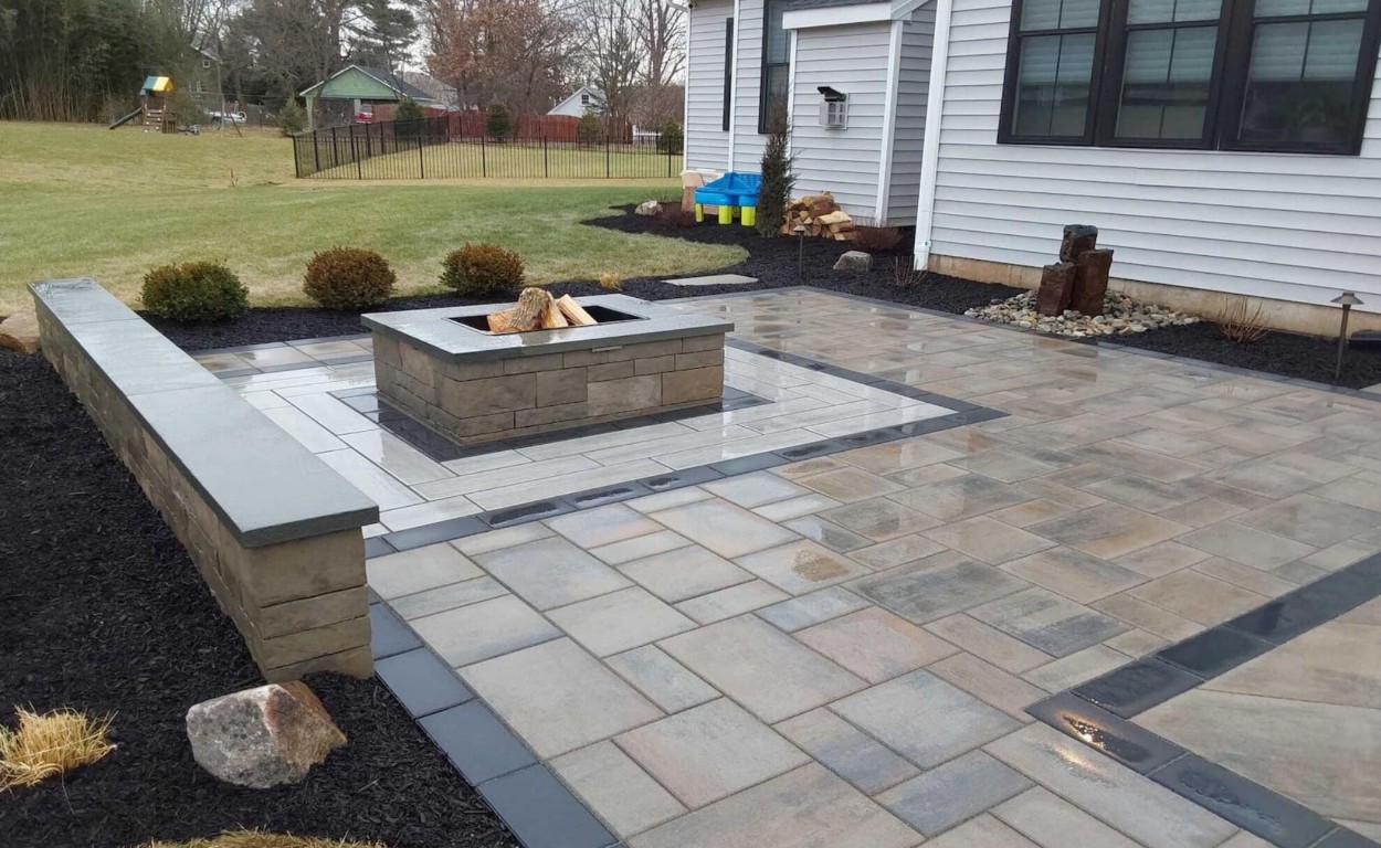 Beautiful decorative concrete patio with fire pit in Burlington, MA